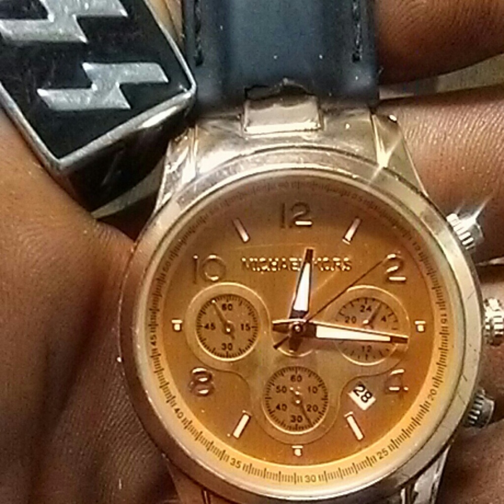 A Michael Kors leather wrist watch